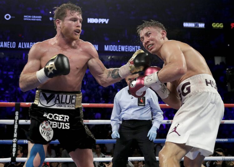 Canelo Alvarez (L) lands a punch against Gennady Golovkin in the 12th round during a middleweight title boxing match, on Sept. 15, 2018, in Las Vegas.