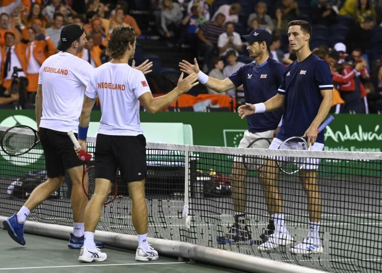 Netherlands’ Wesley Koolhof and Matwe Middelkoop shake hands with Great Britain’s Andy Murray and Joe Salisbury after the Davis Cup.