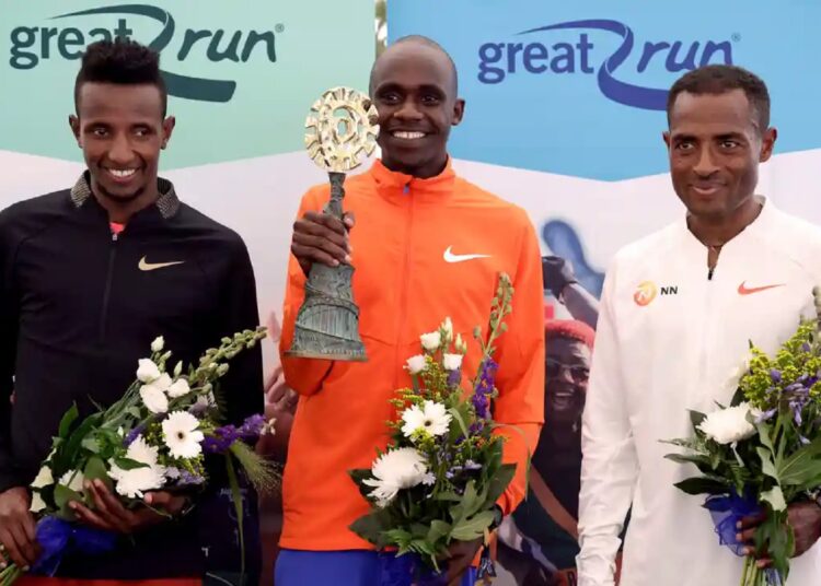 Jacob Kiplimo (C) with Selemon Barega and Kenenisa Bekele.