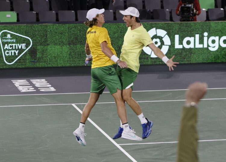 Australia's Matthew Ebden (R) and Max Purcell celebrate during the Davis Cup group C tennis match against France's Nicolas Mahut and Arthur Rinderknech, in Hamburg.