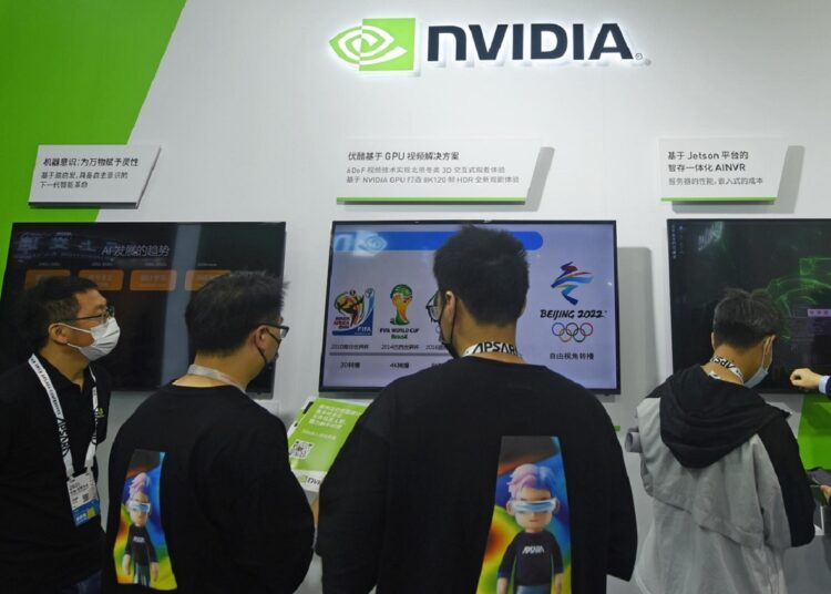 Visitors stop by the booth of Nvidia at the Apsara Conference, an annual cloud service technology forum hosted by Alibaba Group, in Hangzhou in eastern China's Zhejiang province Tuesday, Oct. 19, 2021.