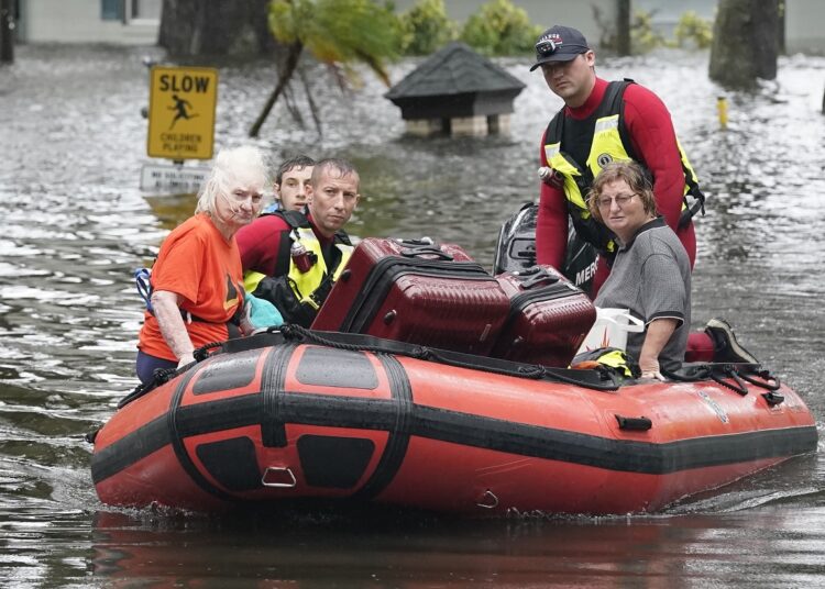 Residents in an Orlando, Fla., neighborhood are rescued due to floodwaters from Hurricane Ian.