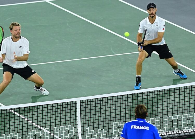 Germany wins first Davis Cup match against France 1 - Egyptian Gazette Germany's Kevin Krawietz in action during his doubles match with Tim Putz against France's Arthur Rinderknech and Nicolas Mahut