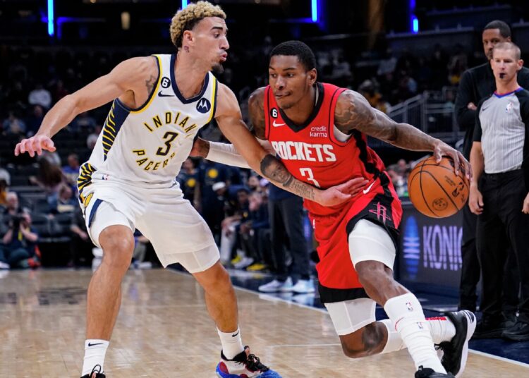 Houston Rockets Kevin Porter Jr. (R) drives on Indiana Pacers Chris Duarte during their NBA preseason game in Indianapolis,