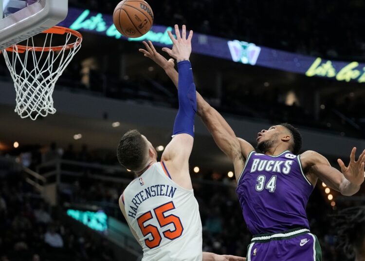 Milwaukee Bucks' Giannis Antetokounmpo shoots past New York Knicks' Isaiah Hartenstein during their NBA game in Milwaukee.