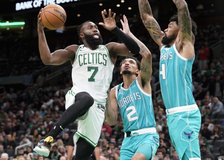 Boston Celtics beat Charlotte Hornets 134-93 1 - Egyptian Gazette Boston Celtics’ Jaylen Brown (L) drives toward the basket past Charlotte Hornets’ James Bouknight (C) and Nick Richards in Boston.