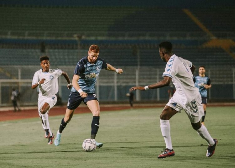 Pyramids' striker Fakhreddine Ben Youssef (C) trying to score against Hilal al-Sahil during their CAF Confederation Cup match.