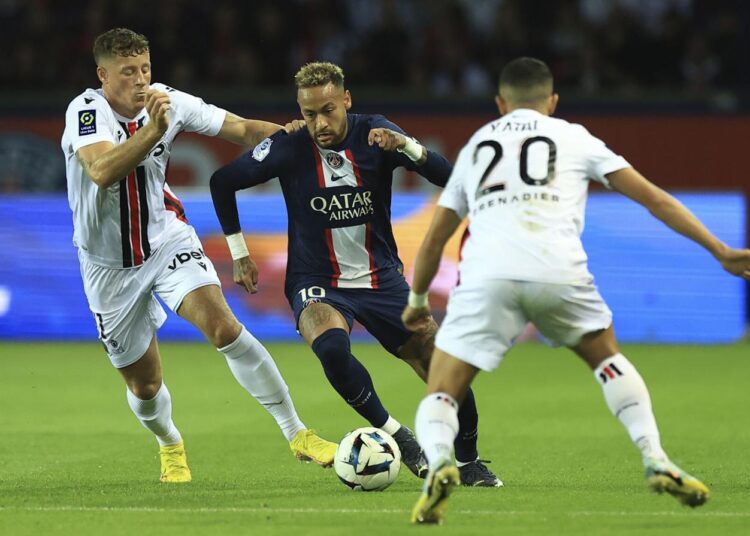 PSG edges Nice in Ligue 1 1 - Egyptian Gazette PSG's Neymar (C) challenges for the ball with Nice's Ross Barkley (L) and Nice's Youcef Atal during their French League One match in Paris.