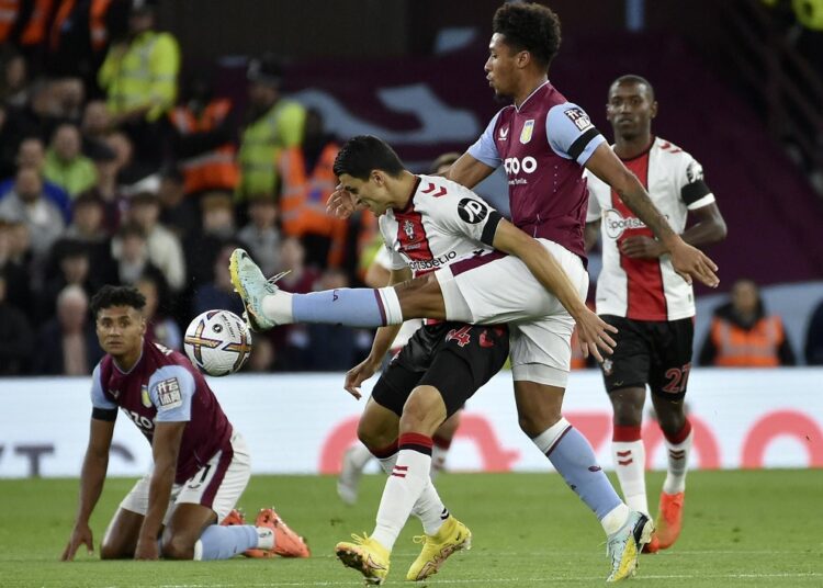 Aston Villa's Boubacar Kamara, center right, vies for the ball with Southampton's Mohamed Elyounoussi during their English Premier League match against Southampton in Birmingham.