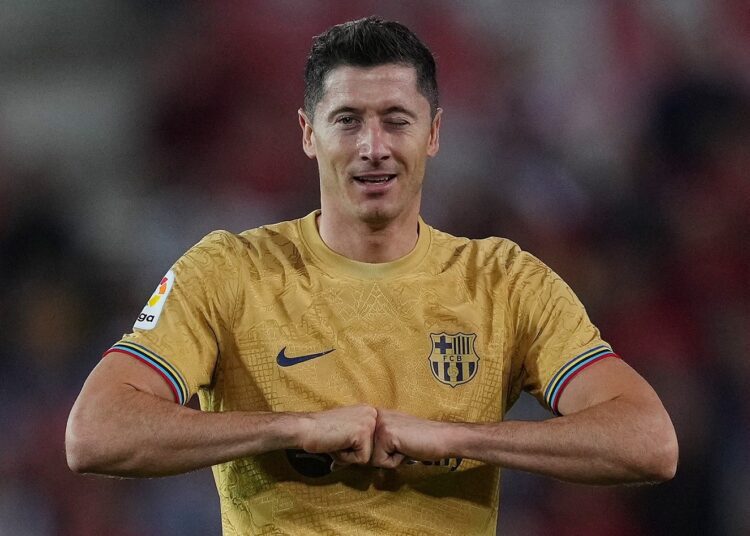 Robert Lewandowski celebrates scoring Barcelona's sole goal against Mallorca.