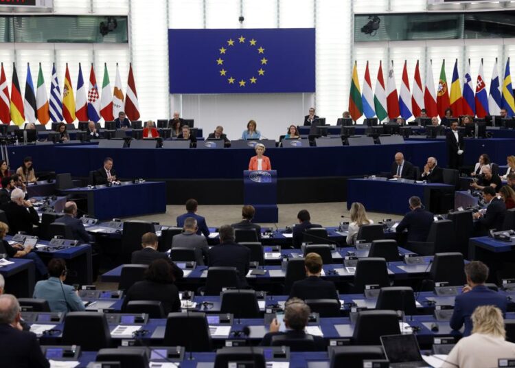 European Commission President Ursula von der Leyen, center, speaks during a commission on Russia's escalation of its war of aggression against Ukraine, at the European Parliament, on Wednesday, October 5, 2022, in Strasbourg, eastern France.