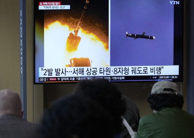N. Korea fires missile, sends fighter jets near border 1 - Egyptian Gazette A TV screen shows file images of North Korea's missile launch during a news program at the Seoul Railway Station in Seoul, South Korea on Oct. 13, 2022.