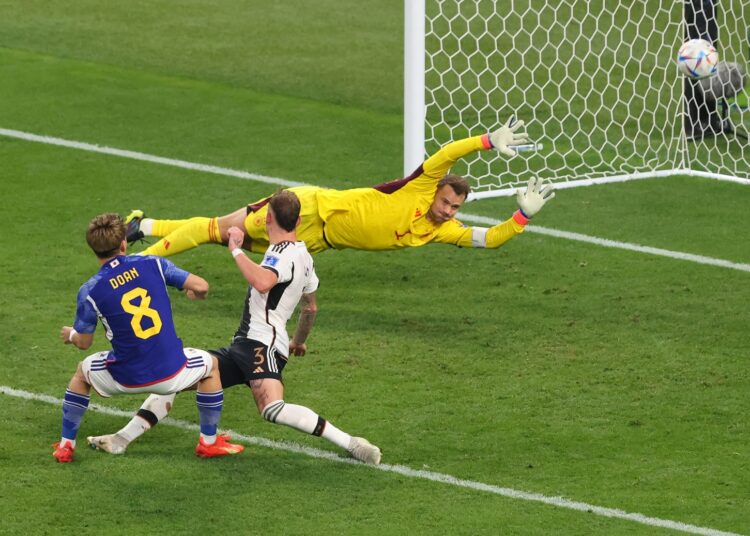 Japan's Ritsu Doan scores his side goal during the World Cup group E game against Germany.