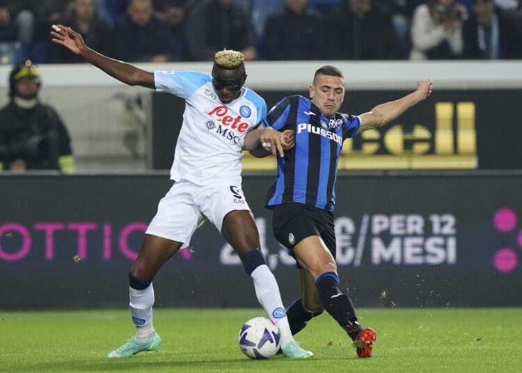 Atalanta's Merih Demiral (R) and Napoli's Victor Osimhen battle for the ball during their Serie A match in Bergamo.