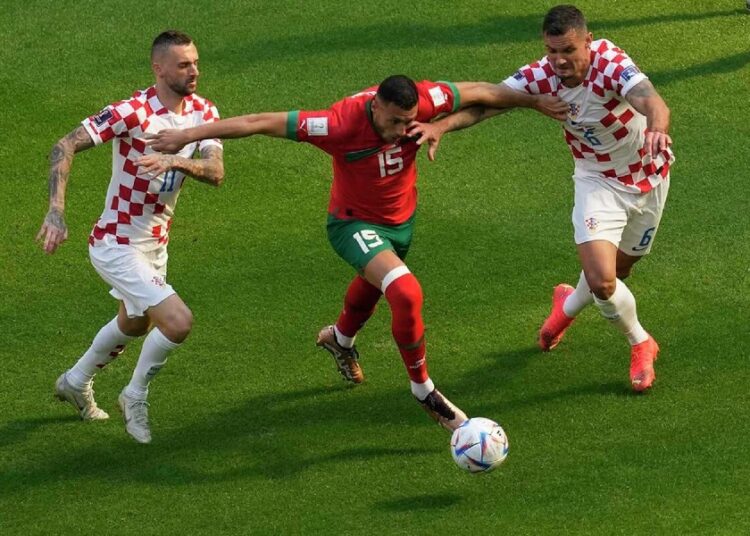 Croatia can't dwell on the past as Canada test looms large 1 - Egyptian Gazette Morocco's Selim Amallah (C) vies for the ball against Croatia's Marcelo Brozovic (L) and Dejan Lovren during their World Cup Group F match on Nov. 23, 2022.