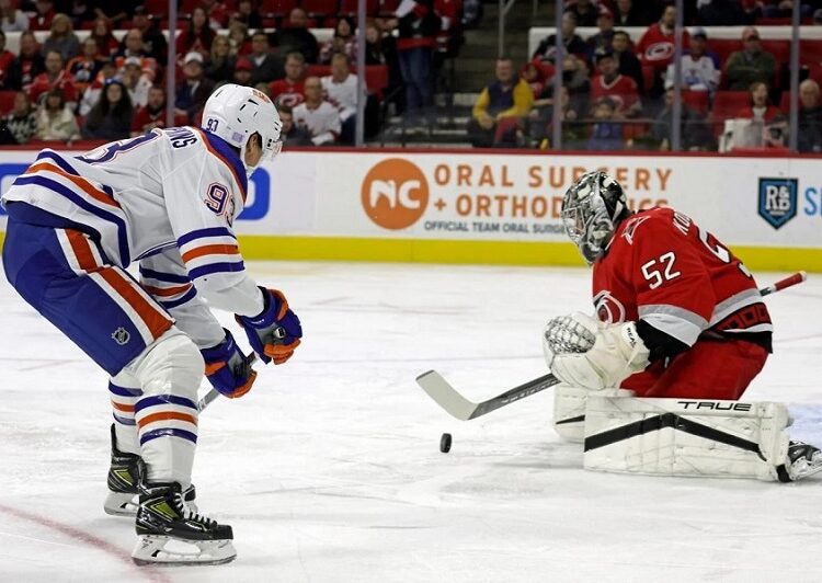 Carolina Hurricanes beat Edmonton Oilers 7-2 1 - Egyptian Gazette Edmonton Oilers Ryan Nugent-Hopkins (L) has his shot stopped by Carolina Hurricanes goaltender Pyotr Kochetkov during their NHL game in Raleigh.