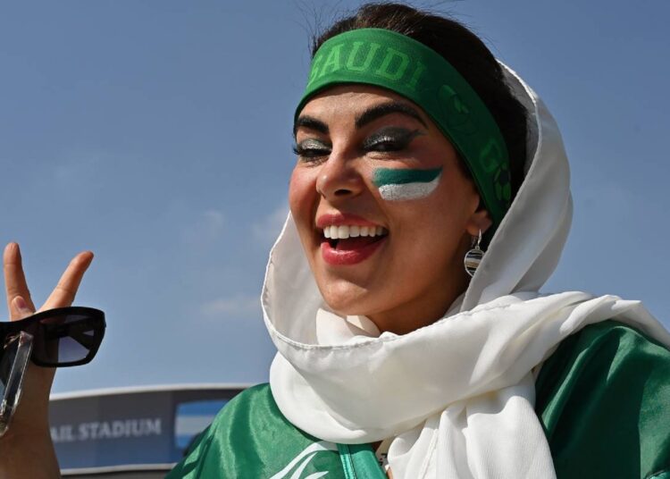 A fan of Saudi Arabia cheers after the World Cup victory against Argentina on Nov. 22, 2022.