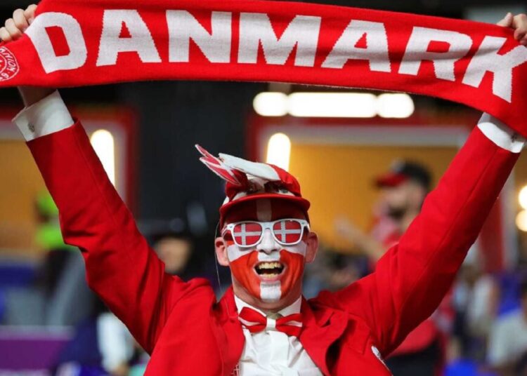 All on the line for goal-shy Danes and confident Australia 1 - Egyptian Gazette A Danish supporter cheers ahead of the World Cup match between France and Denmark on Nov. 26, 2022.