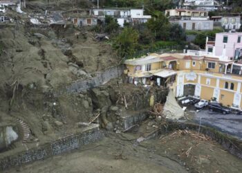 Italian rescuers search for missing in island landslide