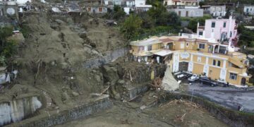 Italian rescuers search for missing in island landslide