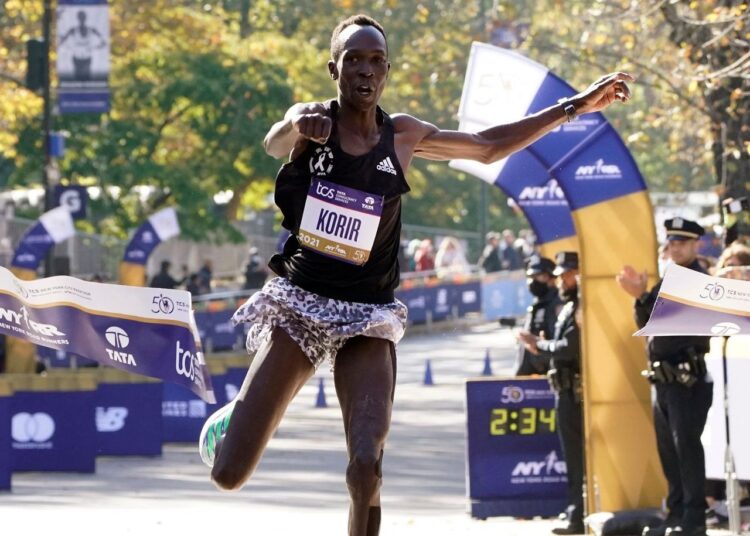 Albert Korir of Kenya crosses the finish line first in the men's division of the New York City Marathon in New York, on Nov. 7, 2021.