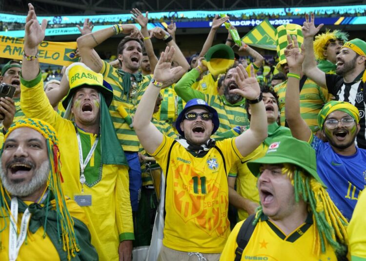 Brazil supporters cheer on the stands while waiting for the start of the World Cup group G match against Serbia, at the Lusail Stadium.