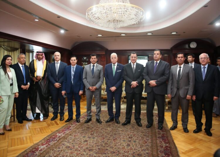 Gen. Fouda (centre) together with the editors of al-Tahrir House after announcing details of the camel racing championship.