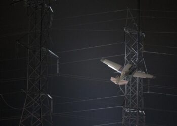 Crews rescue 2 from plane caught in power lines in Maryland