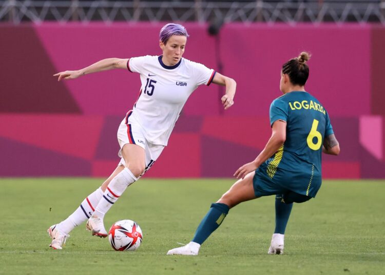America’s Megan Rapinoe is closed down by Australia’s Chloe Logarzo during their Group G match at the Tokyo 2020 Olympic Games in Kashima, Japan.
