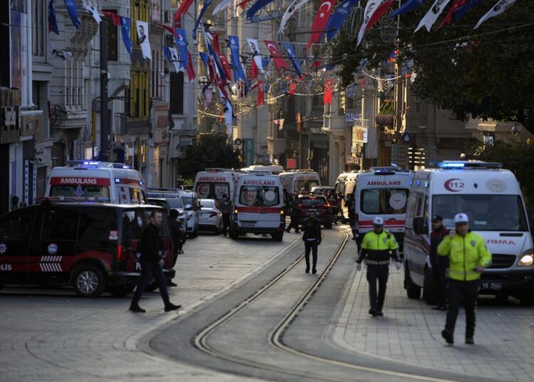 Police vehicles and ambulances are parked at the site of an explosion on the popular pedestrian Istiklal Avenue in Istanbul, Turkey, on Sunday.
