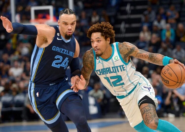 Charlotte Hornets guard Kelly Oubre Jr. (12) drives against Memphis Grizzlies forward Dillon Brooks (24) during their NBA game in Memphis.