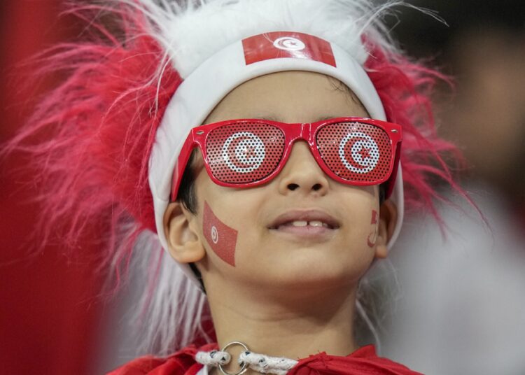 A Tunisian boy looks on prior group D match between Tunisia and France on Nov. 30, 2022.