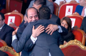 In humanitarian gesture.. Sisi hugs differently-abled person 3 - Egyptian Gazette