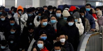 Beijing, Shanghai residents back to work as China eases into living with Covid
