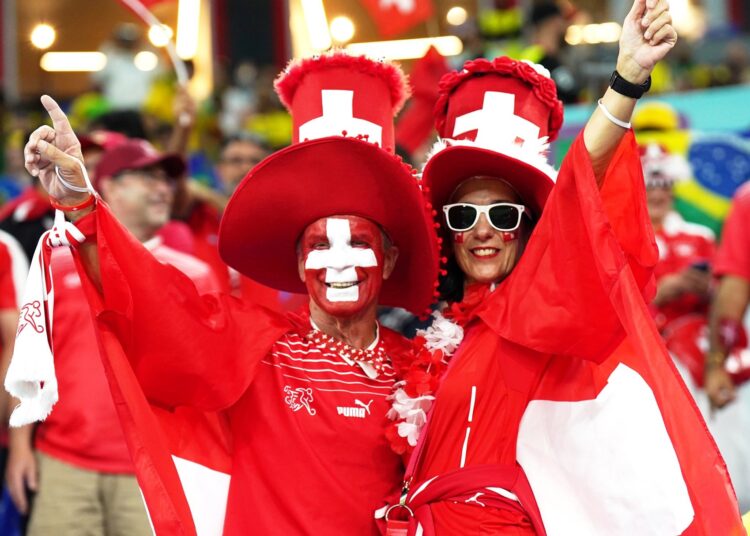 Supporters gesture during group G match between Serbia and Switzerland on Dec. 2, 2022.