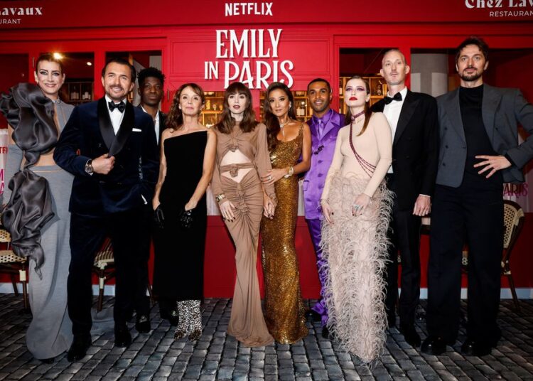 Netflix's 'Emily in Paris' embraces French life in new season 1 - Egyptian Gazette Kate Walsh, William Abadie, Philippine Leroy-Beaulieu, Samuel Arnold, Lily Collins, Ashley Park, Lucien Laviscount, Camille Razat, Bruno Gouery and Lucas Bravo attend the world premiere of the third season of the Netflix series "Emily in Paris" at the Theatre des Champs Elysees in Paris, France, December 6, 2022.