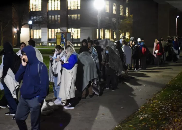 File photo showing hundreds of University of Michigan students wait in line to register to vote at the Ann Arbor city clerk's satellite office at the university's Museum of Art on November 8, 2022.