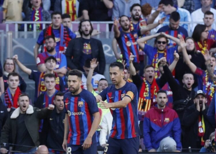 Barcelona held by Espanyol in feisty affair 1 - Egyptian Gazette FC Barcelona’s Jordi Alba reacts after being shown a second yellow and a red card by referee Antonio Mateu Lahoz as Sergio Busquets encourages him to leave the pitch during the match with Espanyol at the Camp Nou in Barcelona.