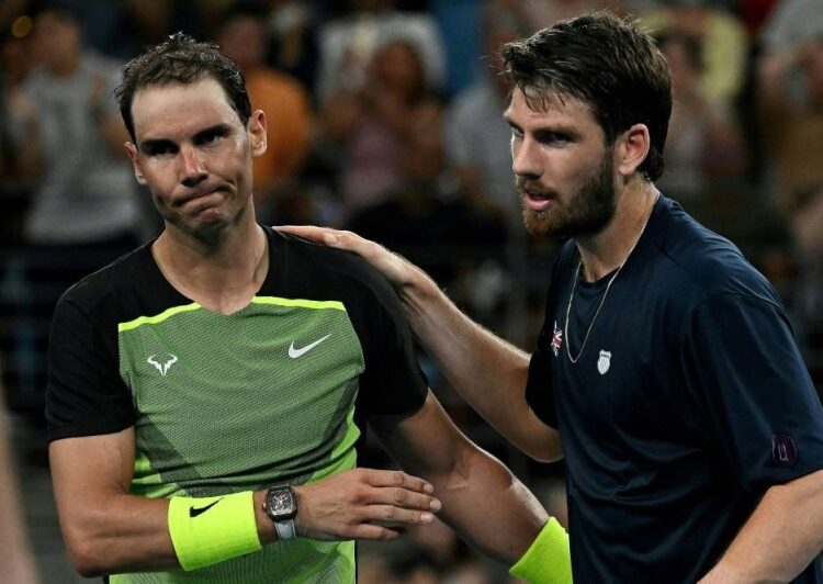 Britain’s Cameron Norrie (right) shakes hands with Rafael Nadal of Spain after winning in the men's singles match on day three of the United Cup tennis tournament in Sydney on December 31, 2022.