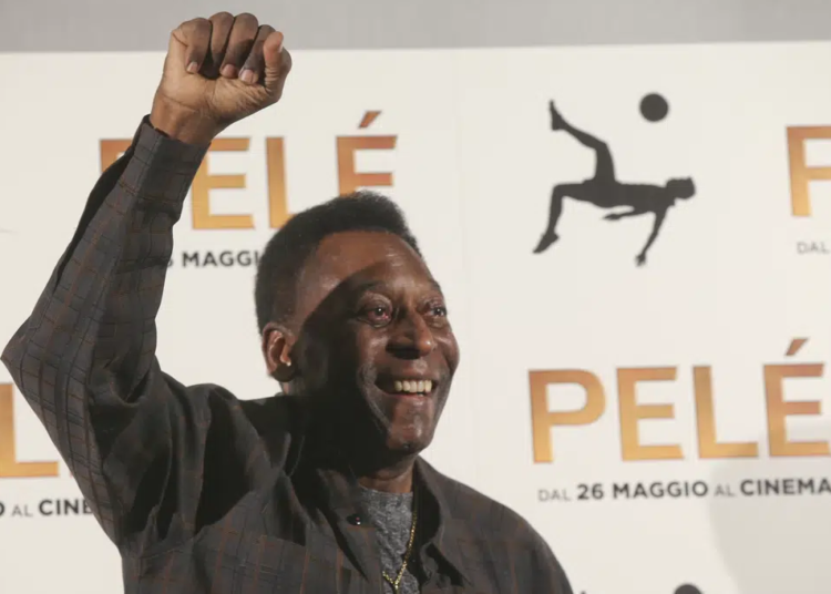 FILE - Brazilian soccer legend Edson Arantes Do Nascimiento better known as 'Pele', gestures during a photocall of the movie 'Pele', in Milan, Italy on May 25, 2016.