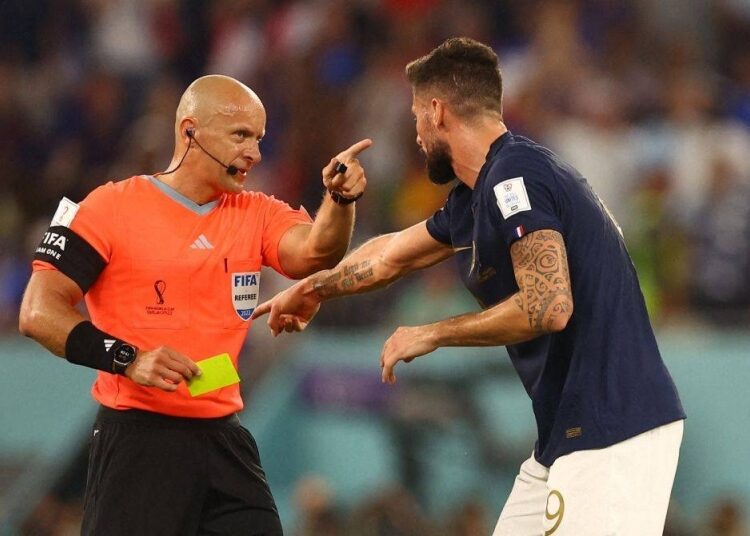 Poland’s Marciniak to referee World Cup final 1 - Egyptian Gazette France's Olivier Giroud reacts towards referee Szymon Marciniak before he shows Denmark's Andreas Christensen a yellow card for a foul on Kylian Mbappe at Stadium 974, Doha November 26, 2022.