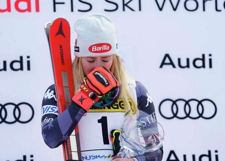 Mikaela Shiffrin is overcome by emotion as she stands on the podium after winning an alpine ski, women's World Cup giant slalom race, in Kranjska Gora, Slovenia.