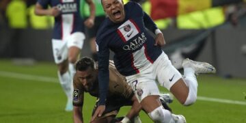 Leader PSG loses 3-1 at Lens for 1st defeat