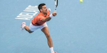 Djokovic recovers from shaky start to reach Adelaide quarters
