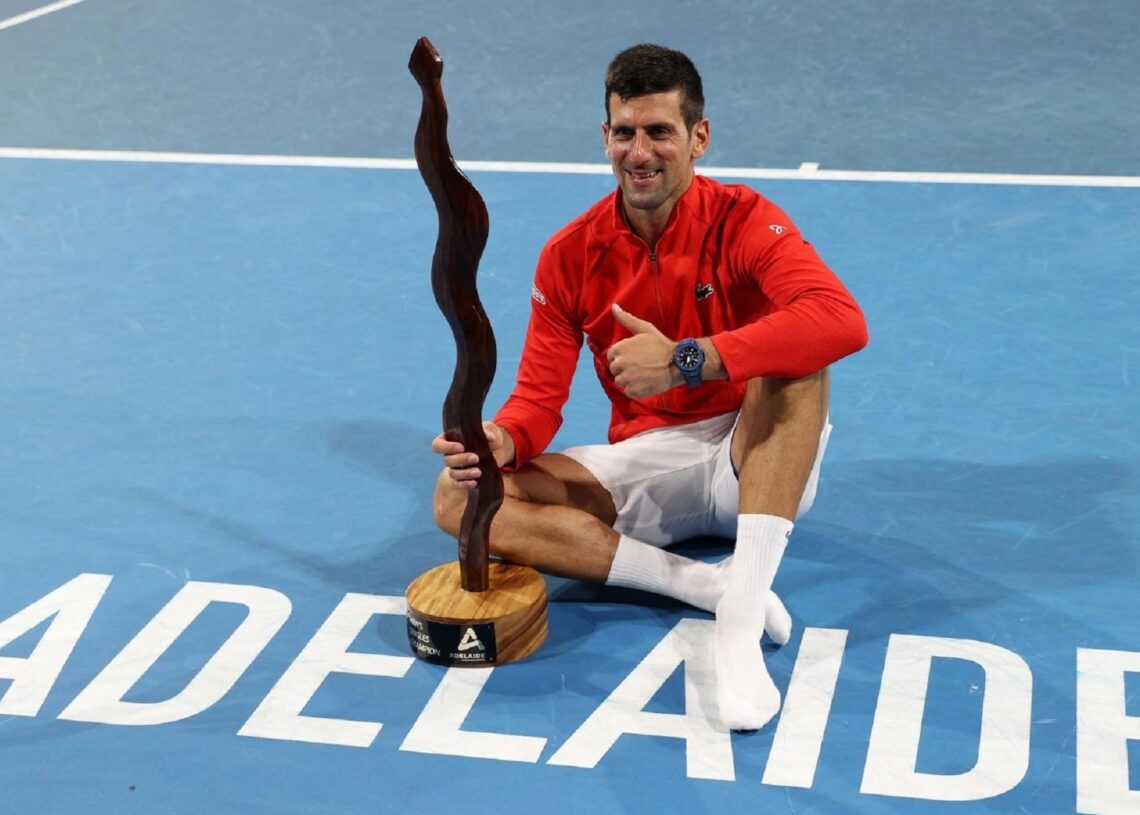 Novak Djokovic poses with the trophy after winning the ATP Adelaide final.