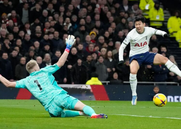 Tottenham's Son Heung-min (R) tries to score past Arsenal's goalkeeper Aaron Ramsdale during the English Premier League match in London.