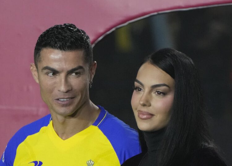 Cristiano Ronaldo accompanied by his partner Georgina Rodriguez greet the crowd during the official unveiling of Cristiano Ronaldo as an Al Nassr player at Mrsool Park Stadium.