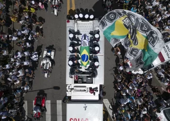 Pelé buried at cemetery in Brazilian city he made famous