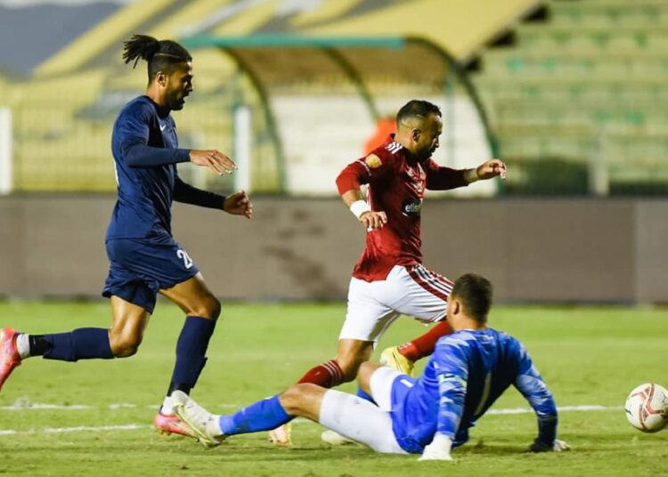 Al-Ahly’s Mohamed Magdi ‘Afsha’ (C) scores his side first goal against Enppi during their match at the Egyptian Premier League.