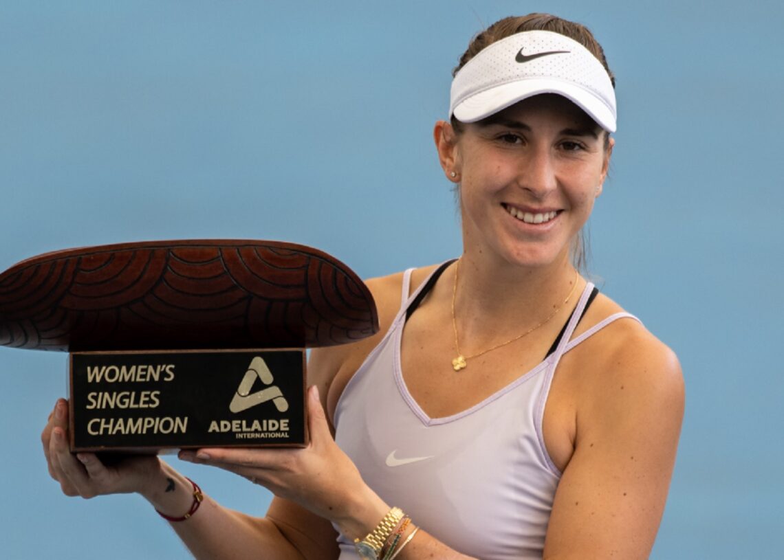 Belinda Bencic celebrates with the Adelaide International trophy.